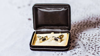 Cufflinks in a jewellery box on a white lace table cloth.  Can be engraved with monogram, initials or name.