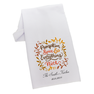 White towel with 'Pumpkin Spice & Everything Nice' text and leaf design on a white background