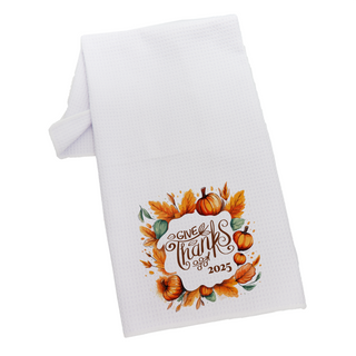 White kitchen towel with pumpkins and Give Thanks design.