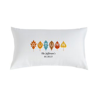Pillow with Autumn design of colorful leaves.