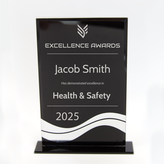 Black award plaque with white text.