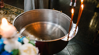 Baptism candles and bowl for water and flowers.