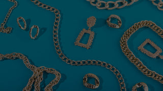 metallic jewelry on a blue background